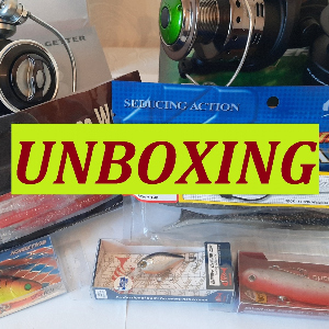 Unboxing посылки с катушками и приманками по заказу Fmagazin.